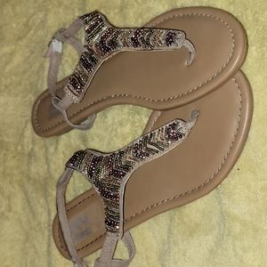 Beaded sandals.